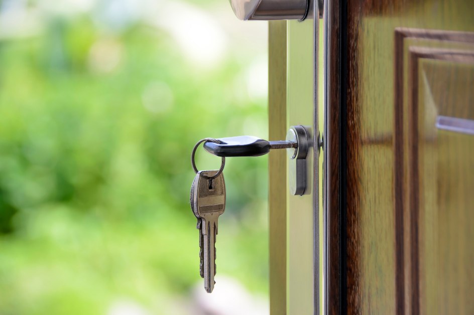 A house key in a front door lock