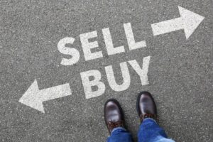 Sell and Buy arrows painted on pavement
